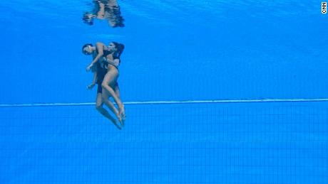 Photographer recalls moment swim coach saved swimmer who fainted underwater