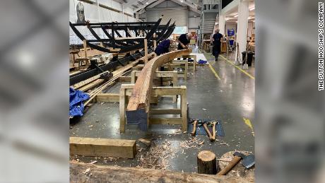 The keel of the ship has been laid and work has begun on the curved hull.