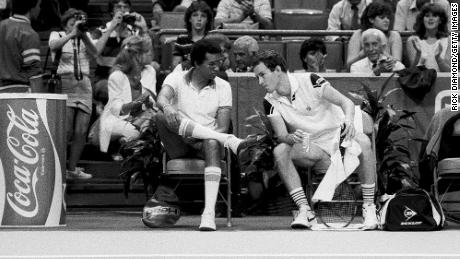 US Captain Ashe and player John McEnroe during the 1984 Davis Cup in Atlanta, Georgia.