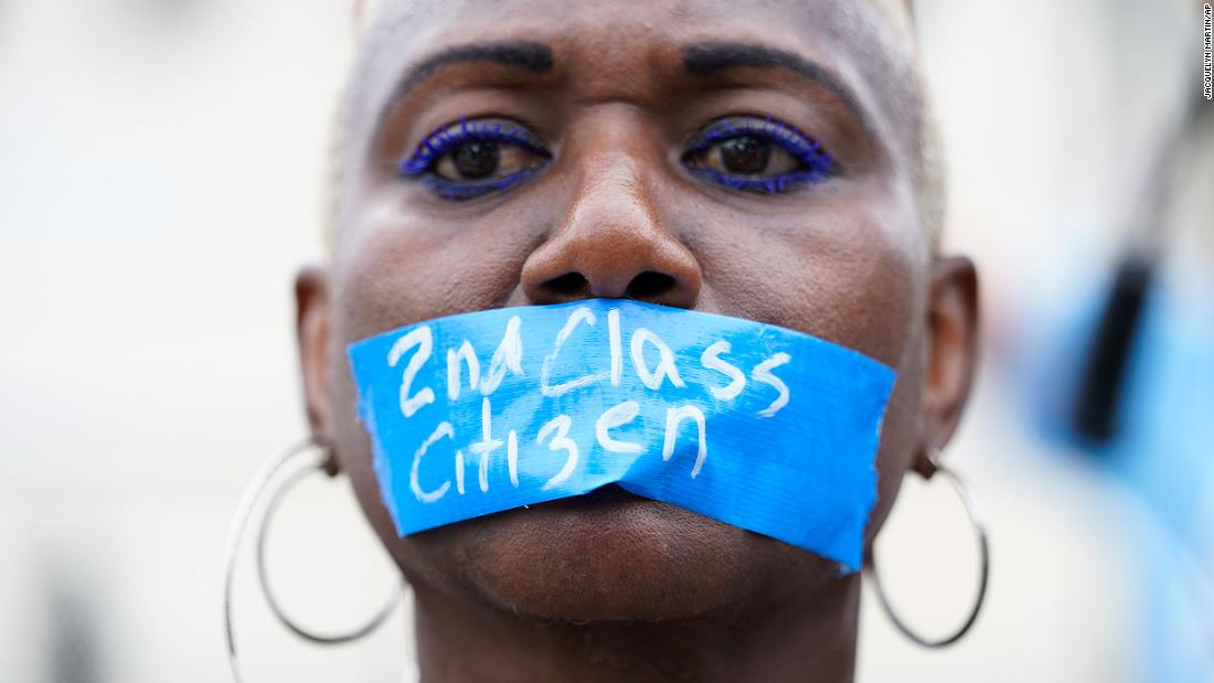A pro-abortion rights activist wears tape across their mouth reading &quot;2nd Class Citizen&quot; in Washington, DC, on Friday.