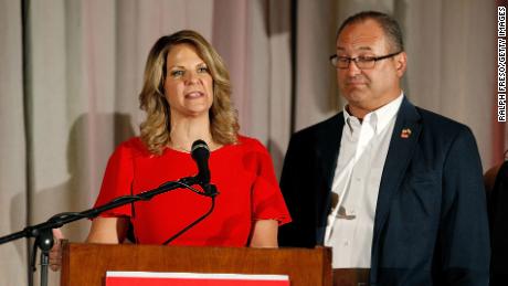 Arizona GOP senate candidate Kelli Ward, with husband Michael Ward by her side, concedes the primary in a speech to supporters at an election night event on August 28, 2018 in Scottsdale, Arizona. 