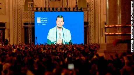 Supporters of Yemen's Houthi movement listen to a speech by their leader Abdel Malek al-Houthi, transmitted via a giant screen inside a mosque in the capital Sanaa on June 22. 