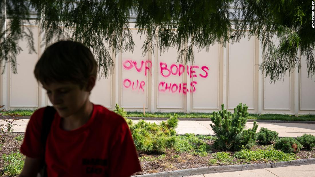 &quot;Our bodies our choices&quot; is spray painted on a temporary wall in Washington, DC, on Friday.