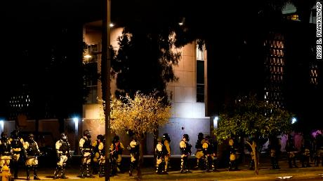 Riot police surround the Arizona Capitol after protesters reached the front of the Arizona Sentate building following the Supreme Court&#39;s decision to overturn Roe v. Wade Friday, June 24, 2022, in Phoenix. (AP Photo/Ross D. Franklin)
