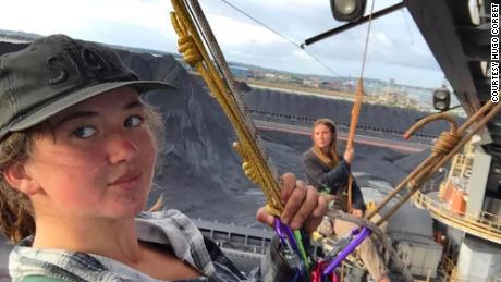 Zianna Fuad (right) and another member of Blockade Australia abseiled off a coal loader at Newcastle in November 2021.  