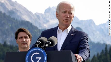 US President Joe Biden (R) addresses a press conference next to Canadian Prime Minister Justin Trudeau and other G7 and EU leaders during the G7 Summit at Elmau Castle, southern Germany, on June 26, 2022.  