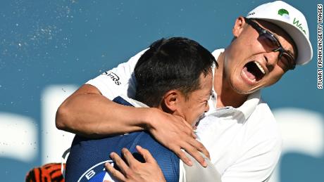 Haotong Li celebrates after winning the BMW International Open at Golfclub Munchen Eichenried.