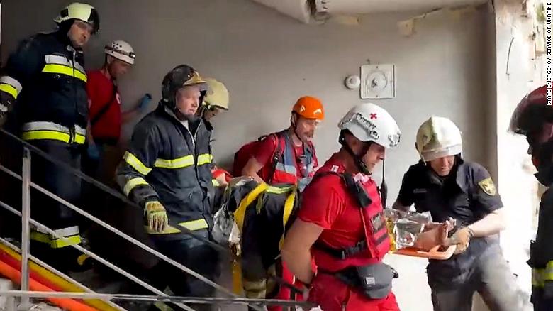 See Ukrainian rescue workers save woman from rubble after missile strike