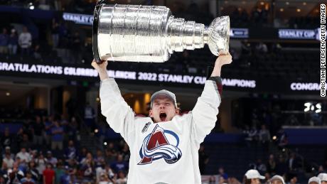 Bowen Byram #4 of the Colorado Avalanche lifts the Stanley Cup after defeating the Tampa Bay Lightning 2-1 in Game Six of the 2022 NHL Stanley Cup Finals.