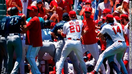 The Seattle Mariners and the Los Angeles Angels clear the benches after Seattle&#39;s Jesse Winker charged the Angels dugout after being hit by a pitch in the second inning.