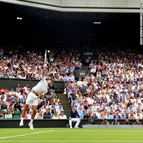 Novak Djokovic serves to Soon Woo Kwon under a closed roof on centre court on day one of the 2022 Wimbledon Championships at the All England Lawn Tennis and Croquet Club, Wimbledon. Picture date: Monday June 27, 2022. (Photo by Adam Davy/PA Images via Getty Images)
