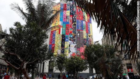 The Truth Commission building in Bogota is covered with 540 meters of cloth woven by men and women belonging to the Seamstresses of Memory.