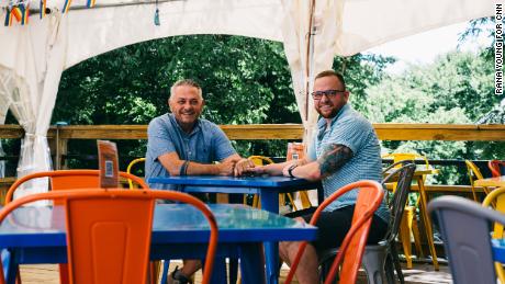 David and Ethan Avanzino sit at the Wanderoo Lodge in Eureka Springs on June 21.