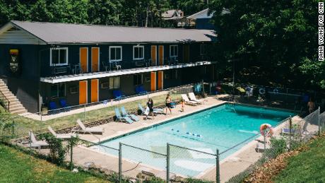 People head to the pool at the Wanderoo Lodge in Eureka Springs on June 21.