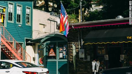 A flag rises above a storefront in downtown Eureka Springs on June 21.