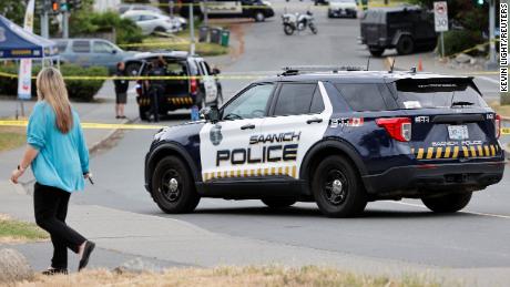 Two armed men were killed Tuesday in a shootout with police outside a bank in Saanich, British Columbia, officials say.