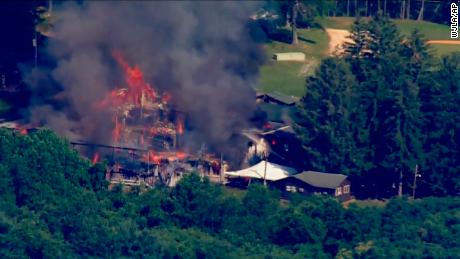 This image taken from video provided by WJLA shows crews battling a fire at Camp Airy for Boys in Thurmont, Md., on Wednesday, June 29, 2022. The building was empty when the fire broke out and no injuries have been reported, Frederick County Division of Fire &amp; Rescue Services spokesperson Sarah Campbell said.  Residents and campers were not in the area of the fire, she said.   (WJLA via AP)