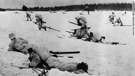 Finnish infantry on skis fighting the Soviet Union during World War II.  After the war, Finland took a neutral position, which was maintained for decades.