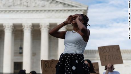 An abortion rights demonstrator leads a chant outside the US Supreme Court in Washington, D.C., US, on Monday, June 27, 2022. A CBS News poll suggested that a majority of Americans disapprove of the Supreme Court&#39;s decision overturning the constitutional right to an abortion, which is inflaming a partisan divide on display in comments by senior lawmakers. 