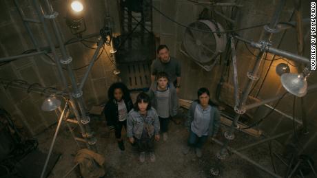(Left to right) Camryn Jones, Riley Lai Nelet, Fina Strazza, Nate Corddry and Ali Wong are pictured in "Paper girls." 
