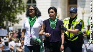 US Capitol police detain Rep. Judy Chu, a Democrat of California, for blocking an intersection with abortion rights demonstrators near the US Supreme Court in Washington on June 30, 2022.