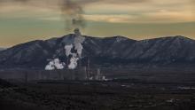 A general view of the hill where Charalambos Mouratidis' farm is located in Akrini, with a coal plant in the background.