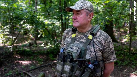 Deep in the eastern Ukrainian forest, this group of volunteers waits as Russia's military creeps closer