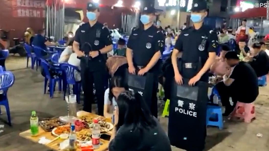 Images show Chinese SWAT officers hovering over unaccompanied women following assaults