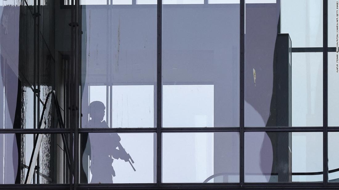 An armed police officer responds to reports of a shooting at the Field&#39;s shopping center in Copenhagen, Denmark, on July 3. Danish police said several people were killed in the shooting.