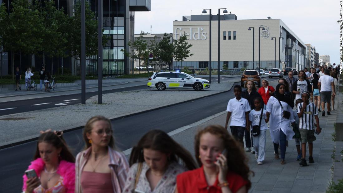People evacuate the Field&#39;s shopping center in Copenhagen, Denmark, after a shooting on July 3. 