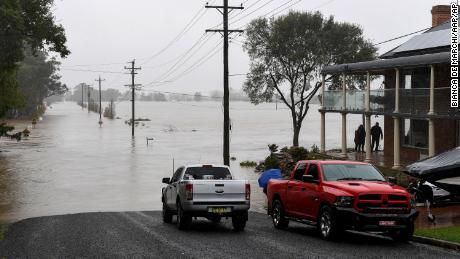 Houses and roads have been flooded by the swollen Hawkesbury River in Windsor, northwest of Sydney, on July 4, 2022.