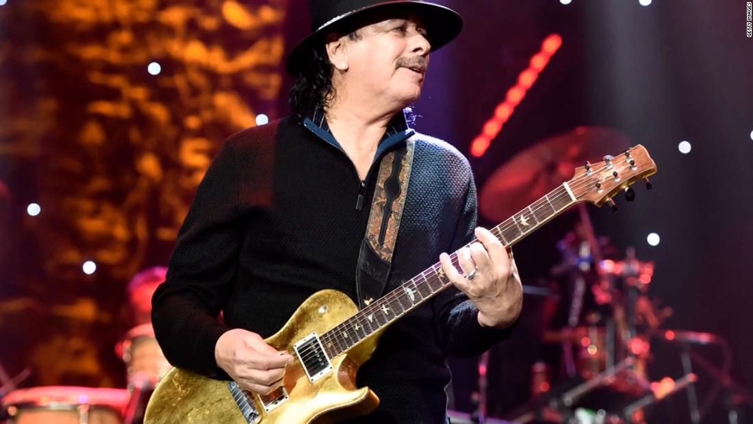 Iconic rock guitarist Carlos Santana suffers heat exhaustion during Michigan concert – CNN Video