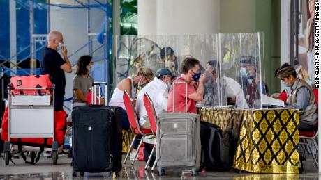 International travelers at Ngurah Rai International Airport on March 7, 2022 in Bali, Indonesia.