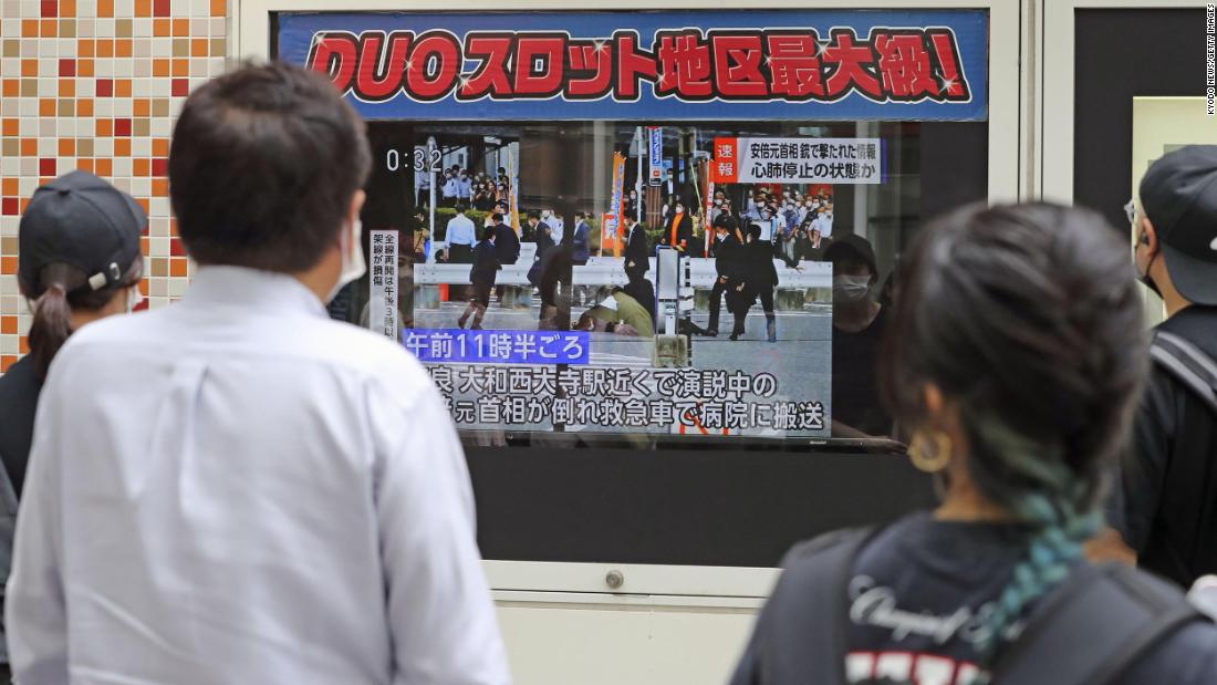 A television screen in Tokyo&#39;s Yurakucho area shows news of Abe&#39;s shooting on Friday.