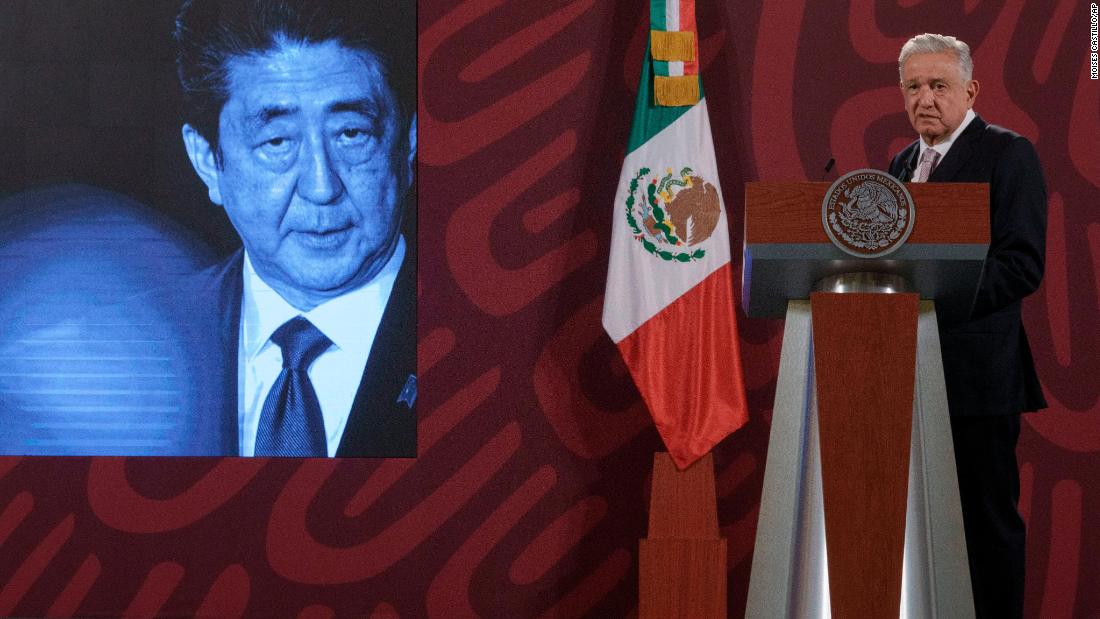 A photo of Abe is displayed on a screen as Mexican President Andrés Manuel López Obrador offers his condolences on Friday.