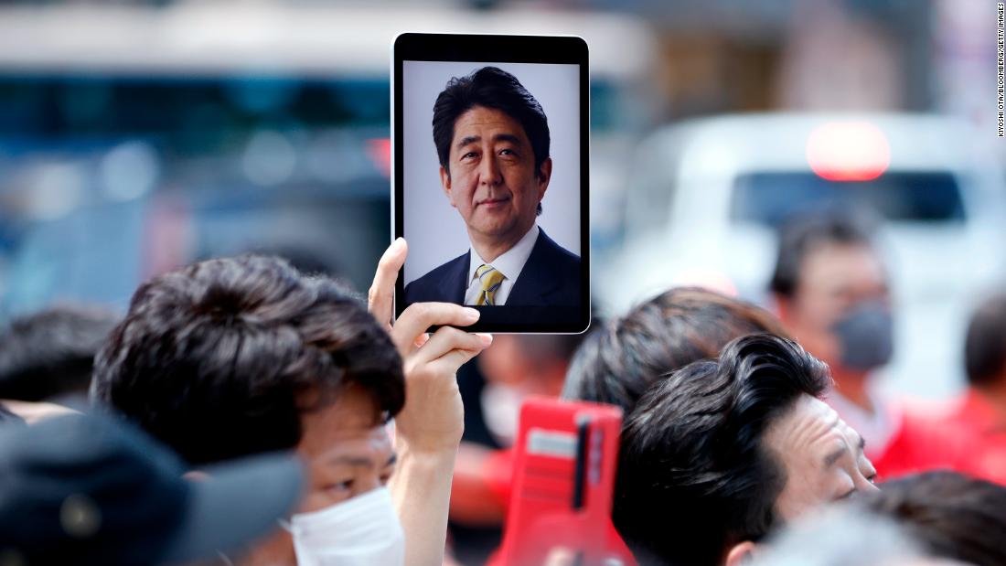 A photo of Abe is displayed on a tablet computer at an election campaign event in Yokohama, Japan, on Saturday.