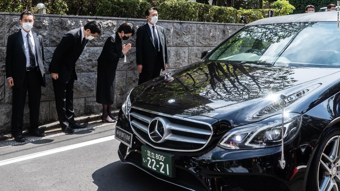 A car carrying the body of former Prime Minister Shinzo Abe arrives at his home in Tokyo on Saturday, July 9.