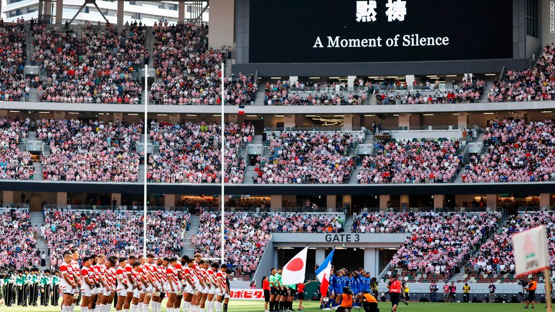 Rugby players from Japan and France observe a moment of silence before a match in Tokyo on Saturday.