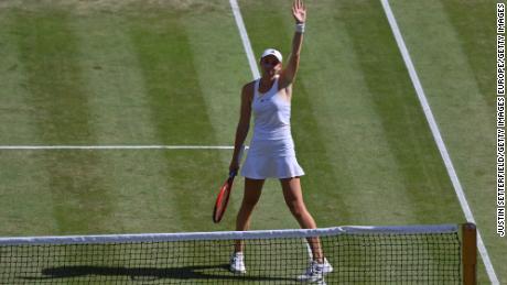 Rybakina celebrates beating Jabeur and winning the women&#39;s singles title at Wimbledon.