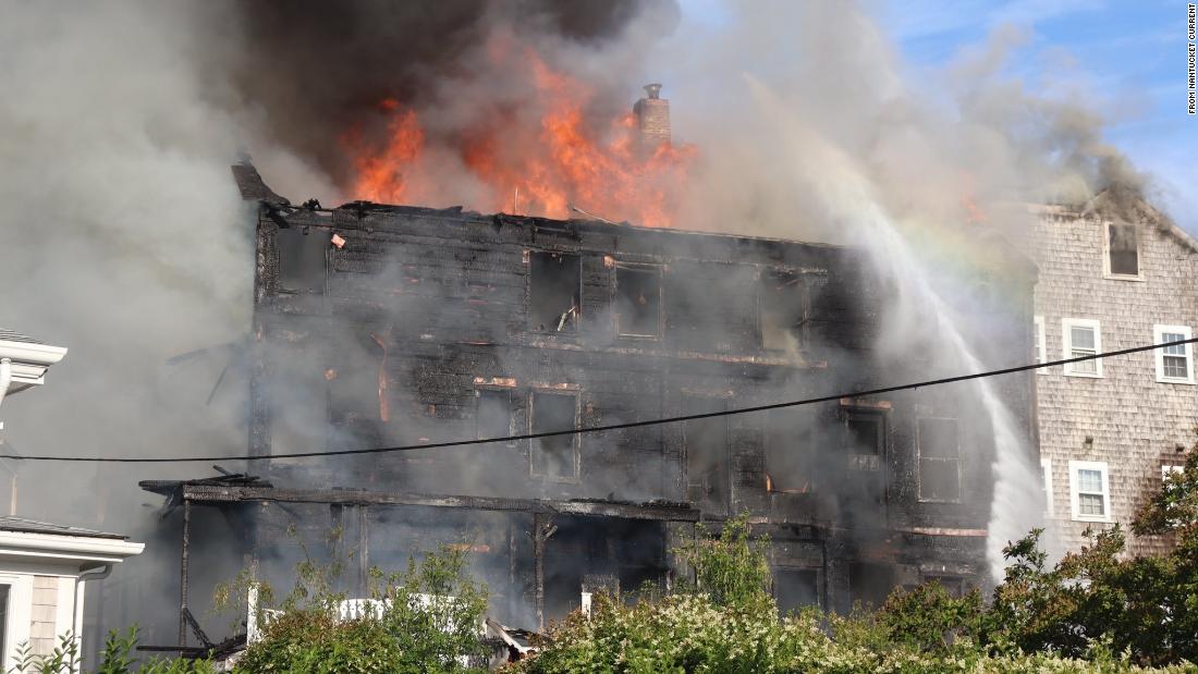 Firefighters are battling a massive blaze on Nantucket Island, which damaged a historic hotel and several other buildings