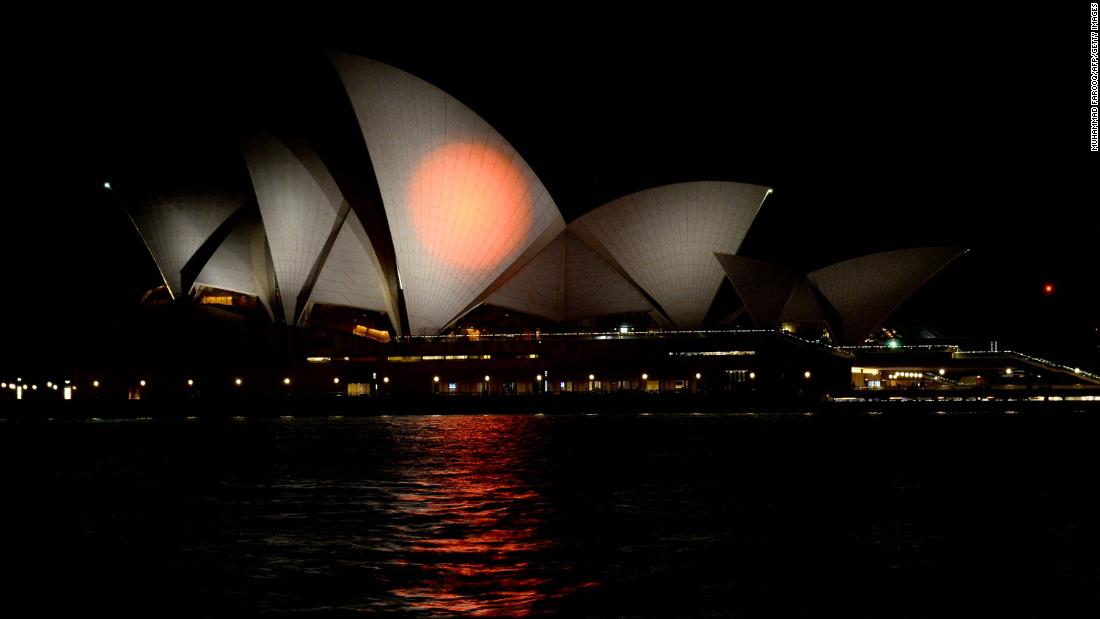 The Sydney Opera House is lit up in the colors of the Japanese flag on July 10 in honor of Abe in Sydney, Australia.