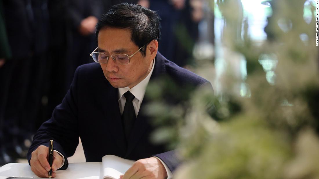 Vietnamese Prime Minister Pham Minh Chinh signs a condolence book for the late former Japanese Prime Minister Shinzo Abe, at the residence of the Ambassador of Japan in Hanoi, Vietnam, on July 11.