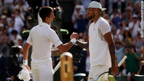 Djokovic and Kyrgios shake hands after the Wimbledon singles final.