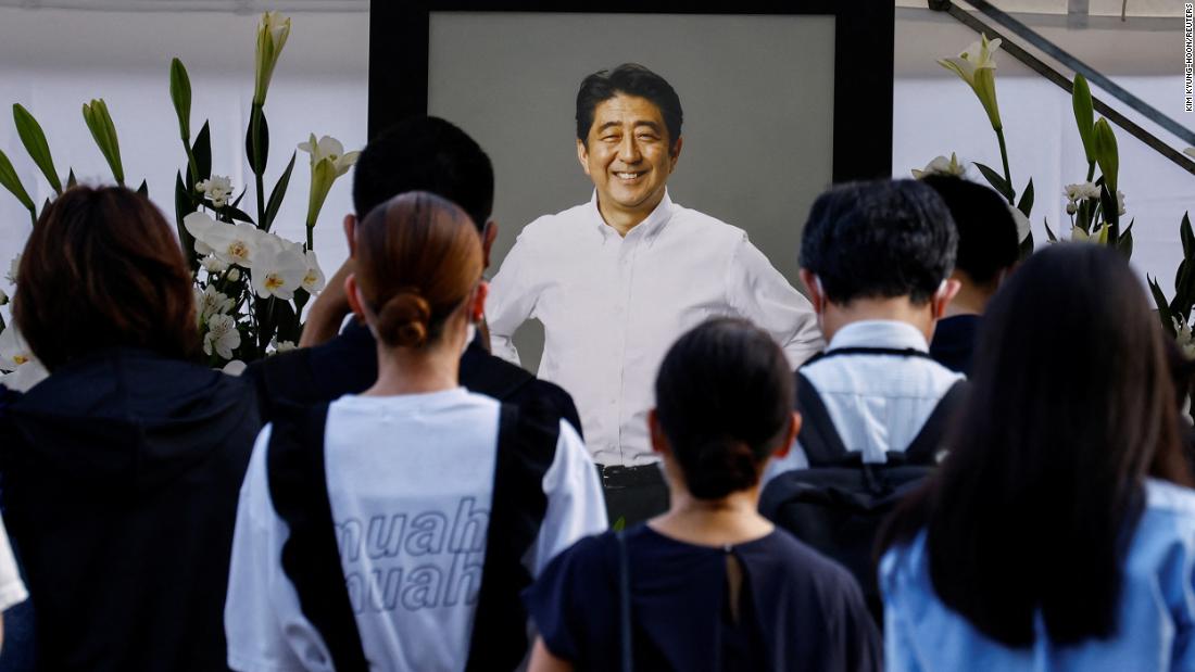 People lay flowers at Zojoji Temple, where the vigil and funeral of late former Japanese Prime Minister Shinzo Abe, will be held in Tokyo, Japan, on July 11.