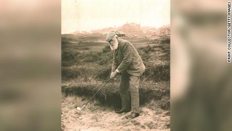 Old Tom Morris, one of golf&#39;s early leaders, is photographed preparing to hit a shot. 