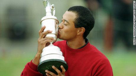 Tiger Woods kisses a claret pitcher after winning the 2000 Open Championship at the Old Course in St. Andrews.