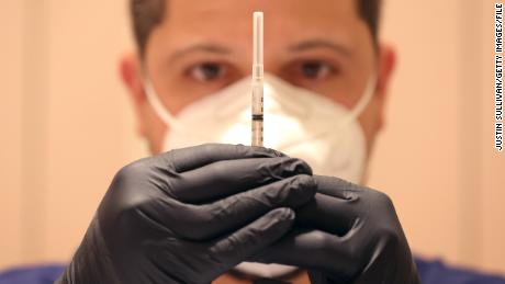 Jatniel Hernandez fills syringes with Covid-19 vaccine booster shots at a Covid-19 vaccination clinic on April 06, 2022, in San Rafael, California. 