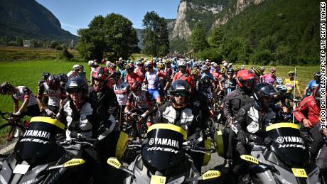The peloton was forced to stop due to protest action on the race route.