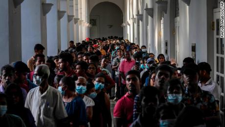 People crowd into the official residence of President Gotabai Rajapaksa three days after it was stormed by anti-government protesters in Colombo, Sri Lanka, July 12.