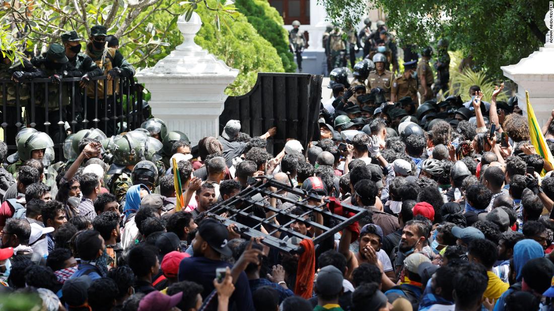 Protesters storm Sri Lanka's prime minister's office, as president flees country without resigning